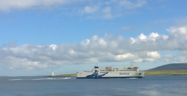 Hamnavoe passing the Graemsay lighthouse in Hoy Sound