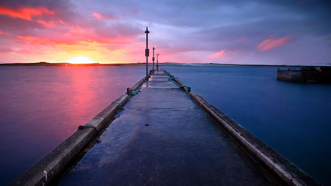 Rousay pier during sunrise by Premysl Fojtu