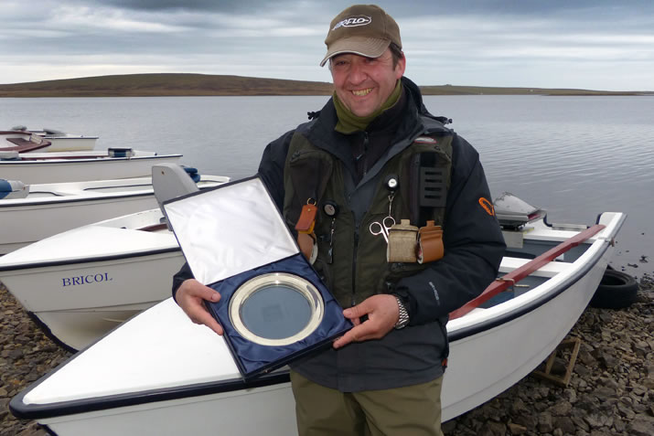 Neil Chalmers with a fishing trophy