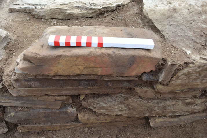 Coloured stone incorporated into St 8 at the Ness of Brodgar, Orkney