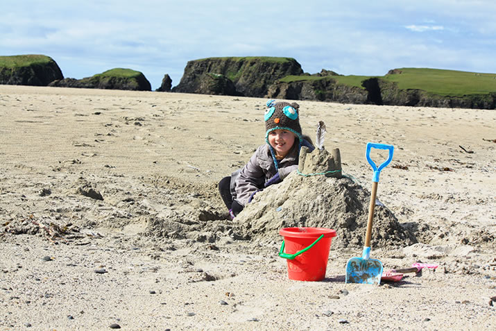 Playing on St Ninians Isle beach, Shetland