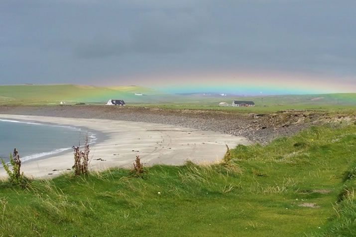 Rainbow on an Orkney beach