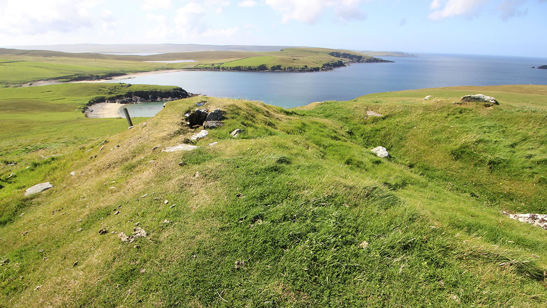 Broch and sandy bay where longships arrived in Unst, Shetland