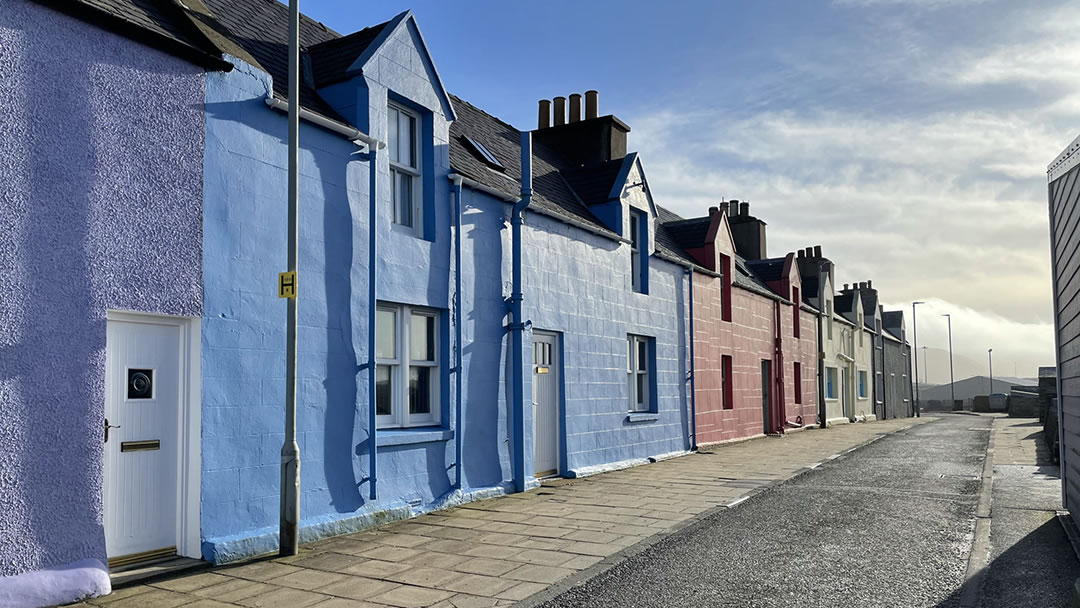 Colourful and vibrant houses on the New Street road, Scalloway, Shetland