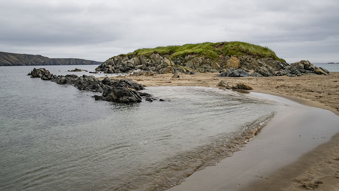 Norwick beach and a section of the earth's crust in Unst, Shetland