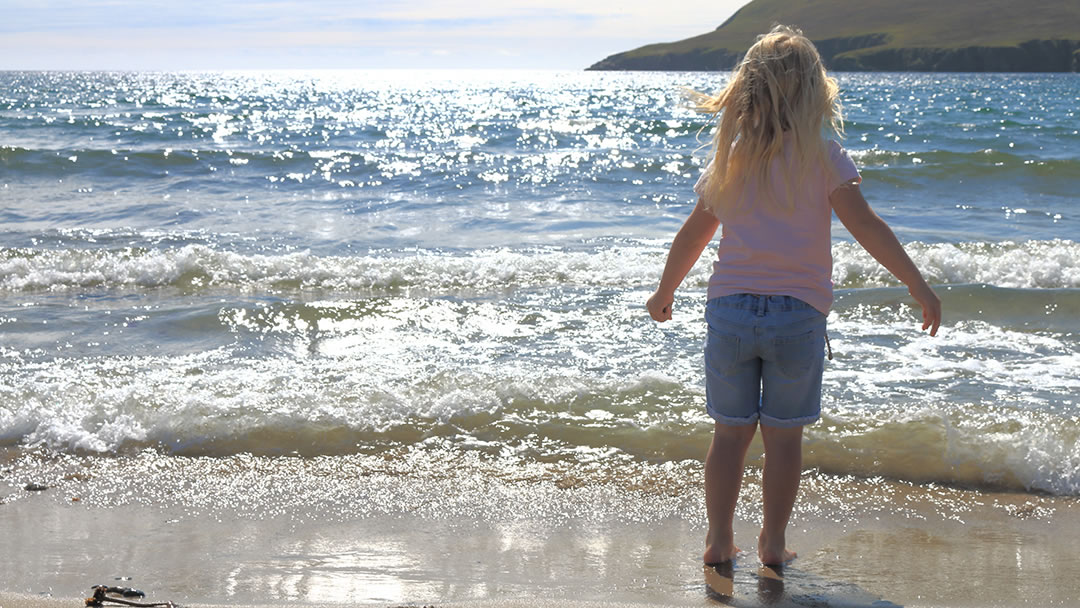 Paddling at Tresta beach in Fetlar, Shetland