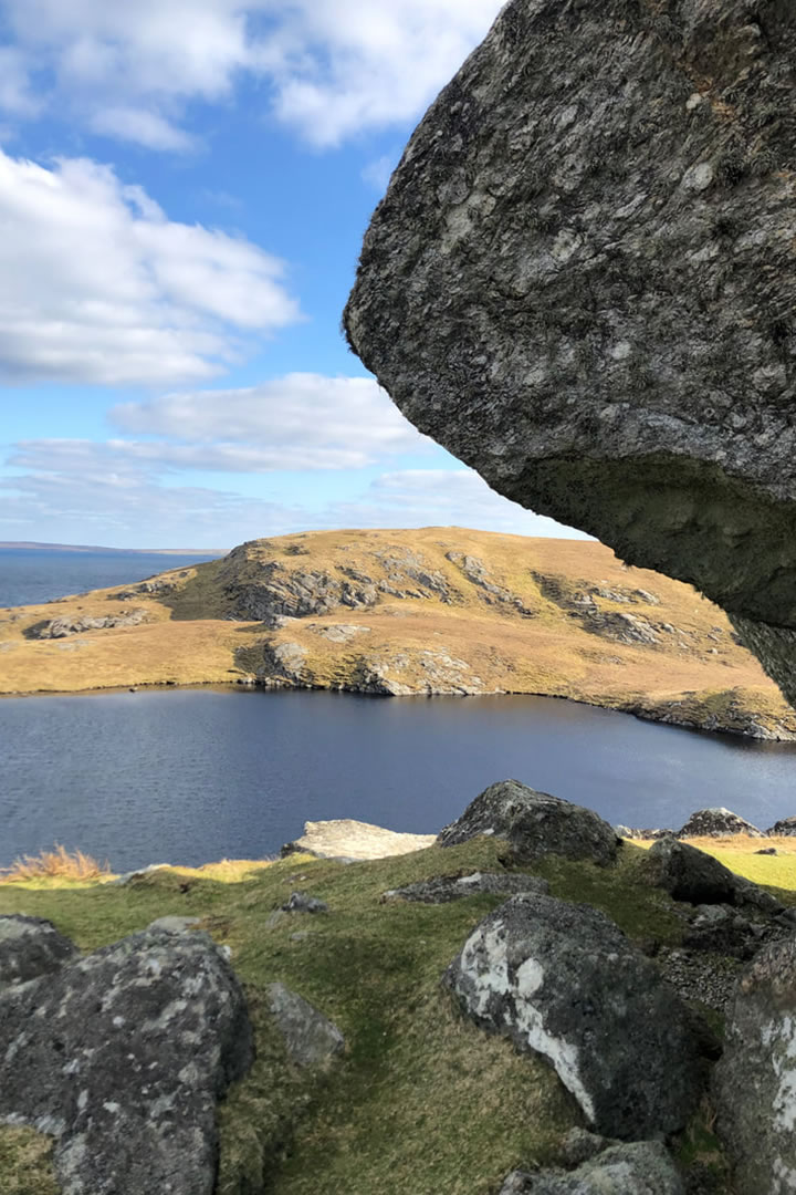 Peeping out under the Stones of Stofast and out to sea