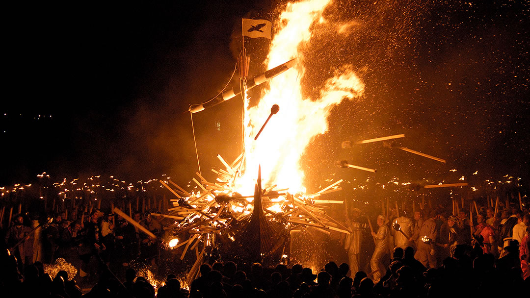 Throwing flaming torches into the galley during Up Helly Aa, Shetland