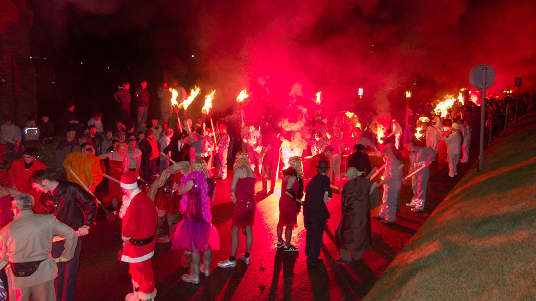 Guizers lighting up during Up Helly Aa