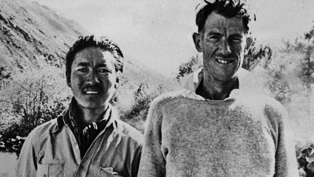 Norgay and Hillary wearing Shetland jumpers on Everest