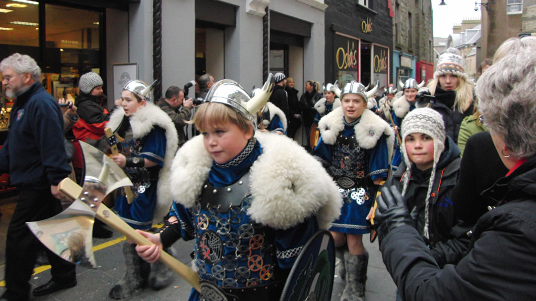 The Junior Jarl Squad on parade through the streets of Lerwick, Shetland