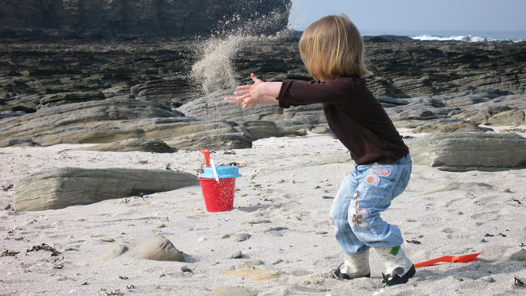 Playing on the beach at the Brough of Birsay in Orkney
