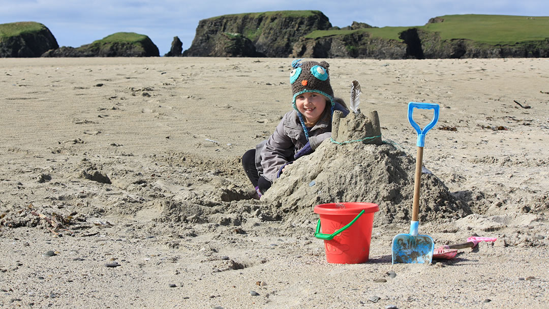 Playing on St Ninians Isle beach, Shetland