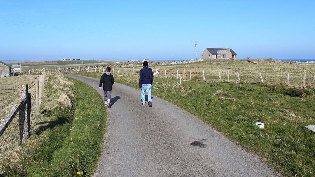 Danny and Robbie walking the roads of Wyre in Orkney