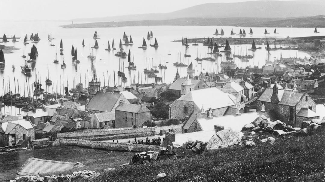 View of herring boats in Stromness harbour from Brinkies Brae
