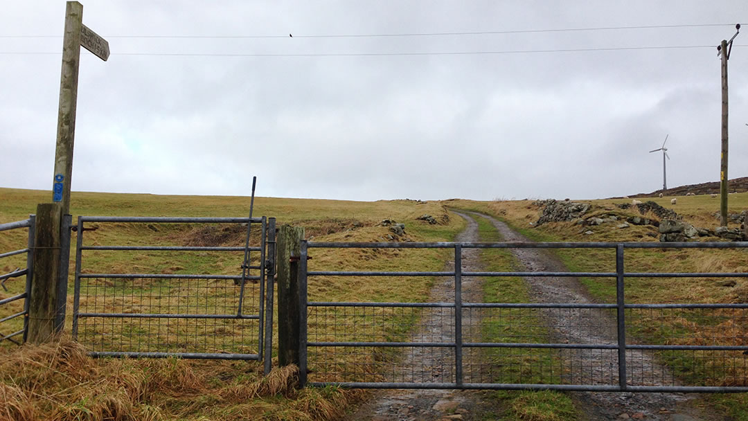 The first gatepost on the walk to Culswick Broch in Shetland