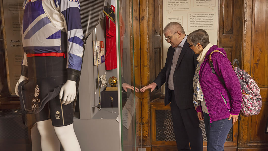 A couple viewing the displays at Provost Skene House