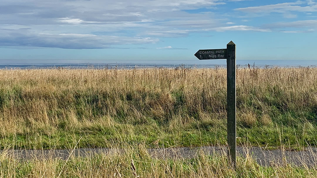 Coastal path signpost to Nigg Bay