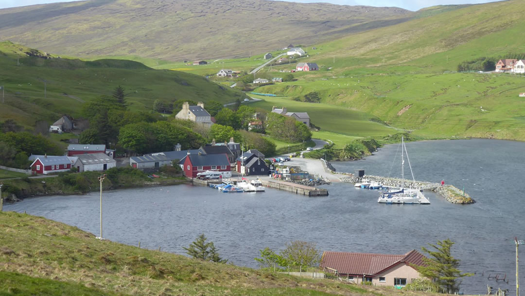 The Sail Loft can be seen as a red building on the shore of Voe