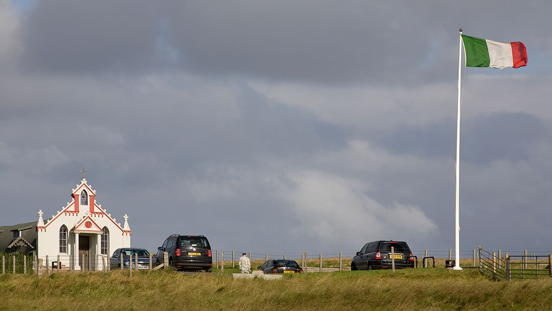 The Italian Chapel and flag in Lamb Holm, Orkney