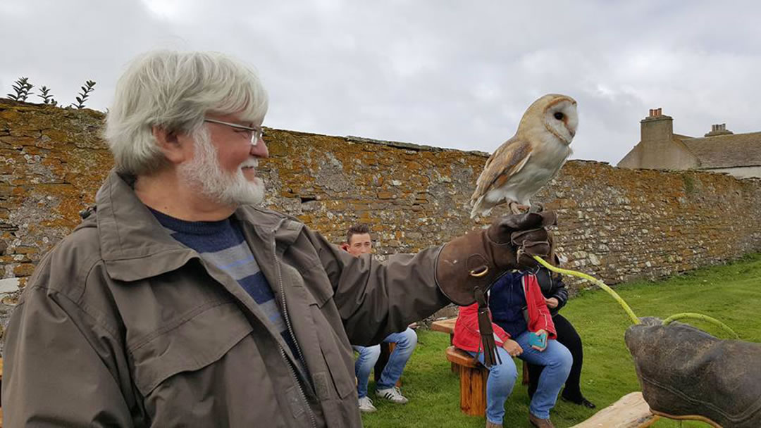 Handling an owl at the Skaill House Falconry, Orkney