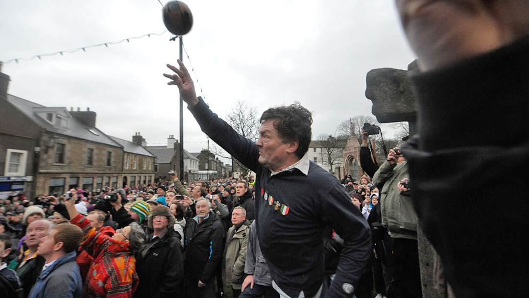 Throwing the Ba’ at the start of the Ba’ in Kirkwall, Orkney