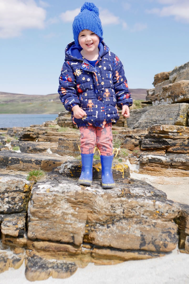 George playing on an Orkney beach