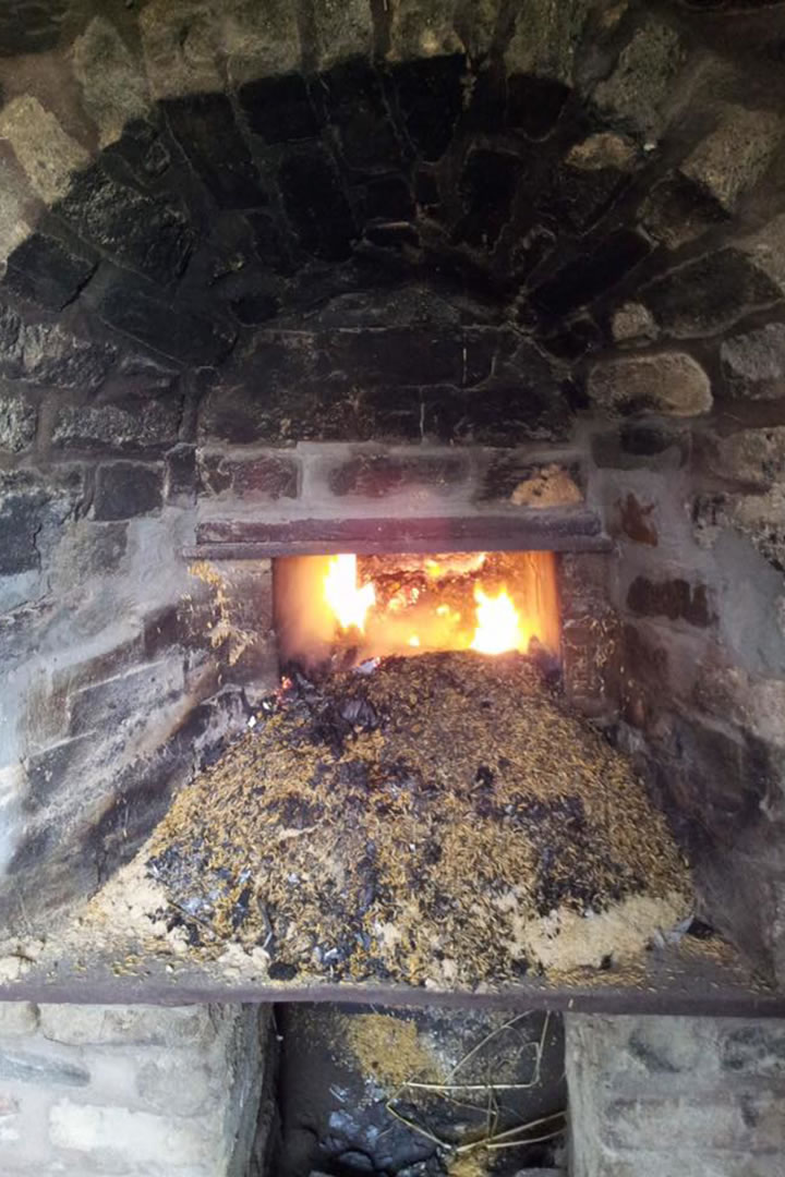 Husks on fire to dry grain at the Barony Mill, Orkney