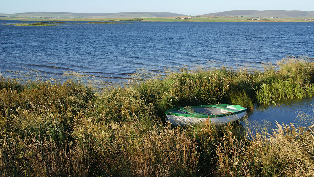 Boat moored by the side of the Loch of Harray