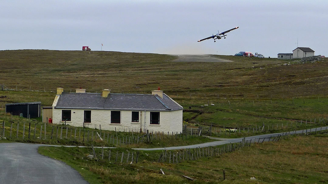 The Manse and a takeoff from the Foula airstrip
