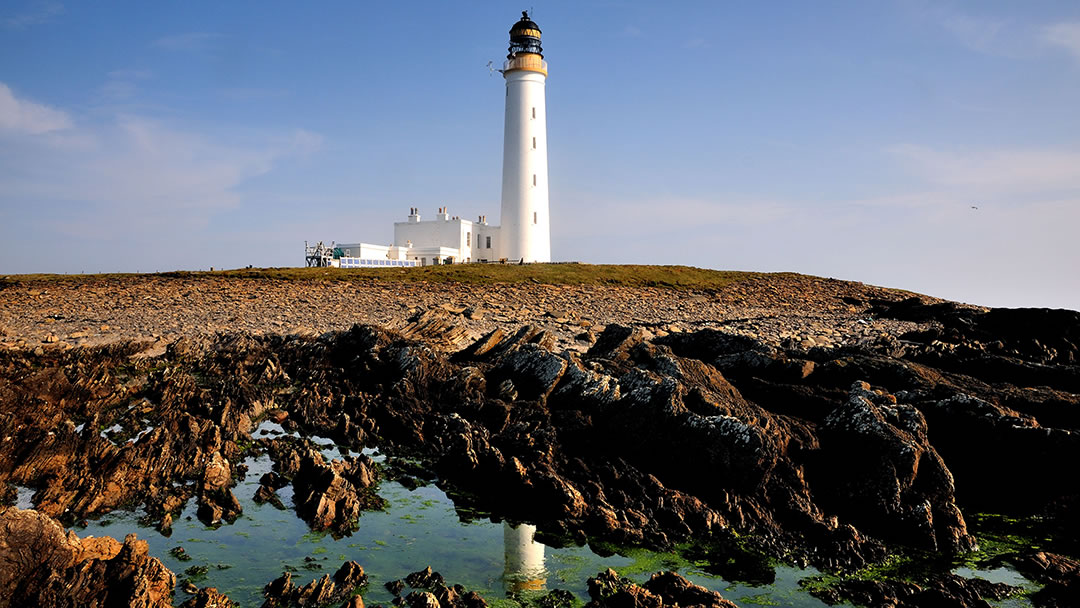 Auskerry Lighthouse and rockpools