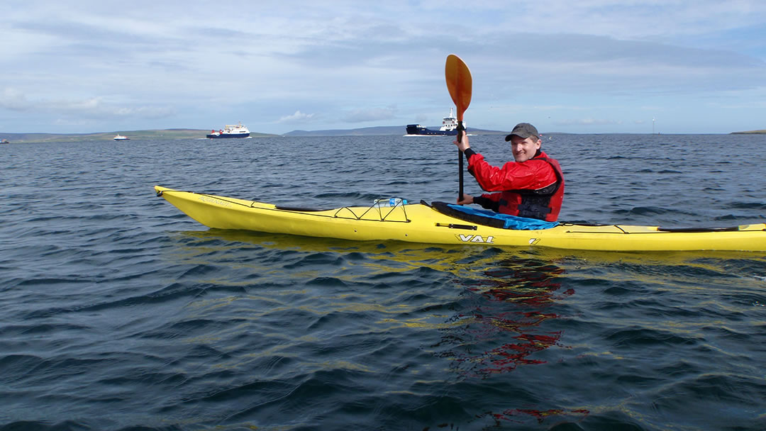 Robin kayaking in Kirkwall Bay