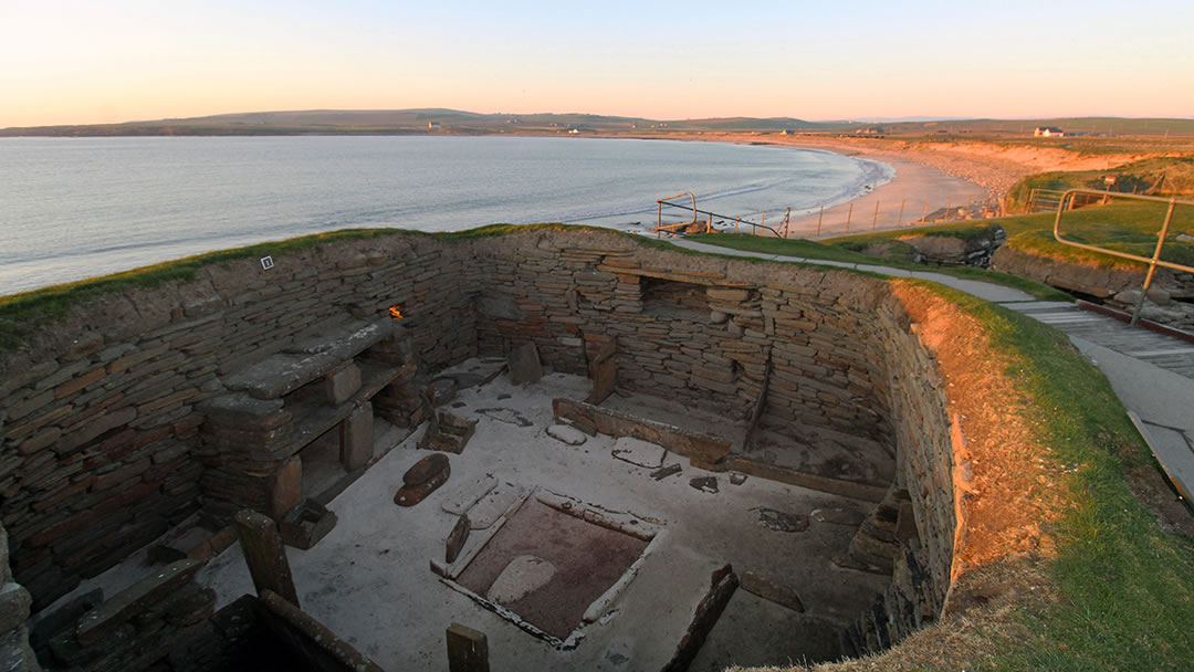 Skara Brae and Skaill beach at sunset