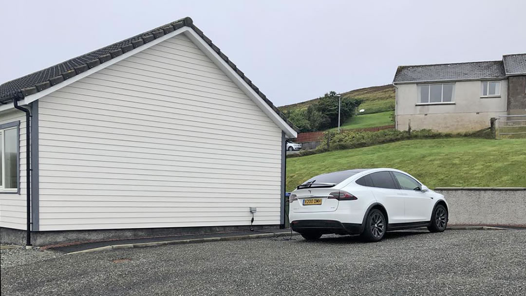 Charging an electric vehicle at Shetland accommodation