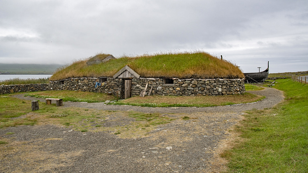 The reconstructed Viking longhouse, next to the Skidbladner