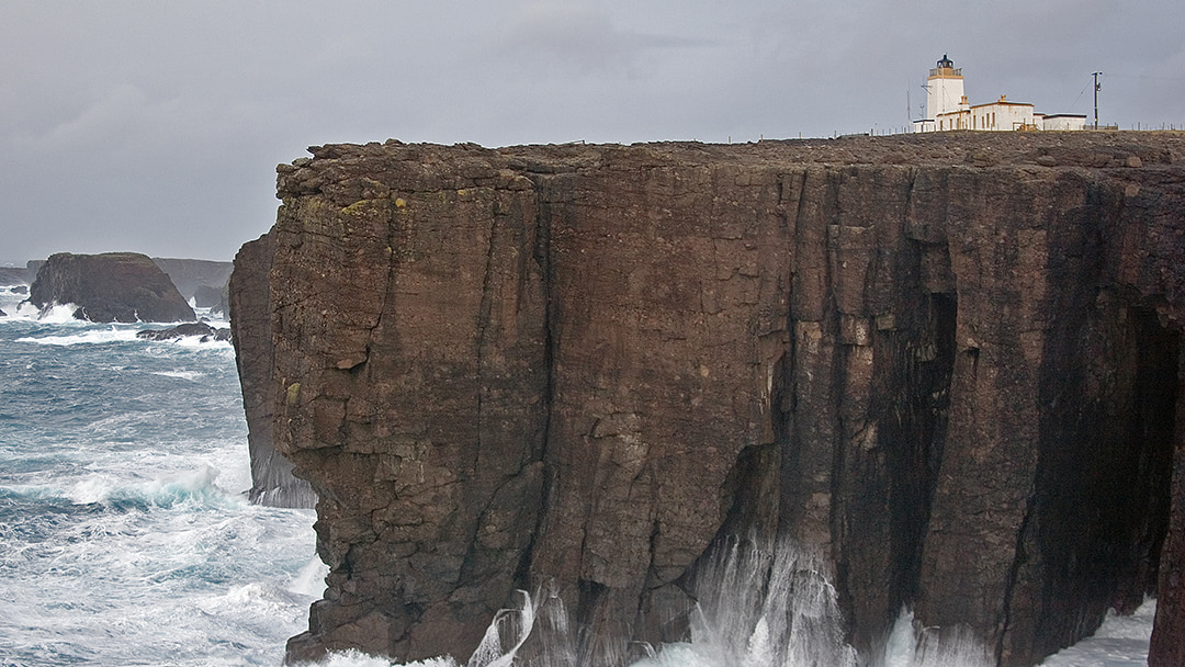 Eshaness Lighthouse perched on top of the cliffs edge