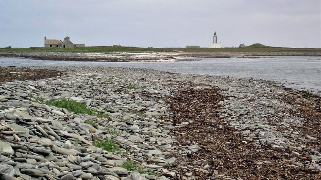 Start Point Lighthouse in Sanday with Mount Maesry to the right and Ayre Sound to cross