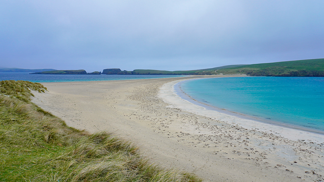 The beautiful turquoise waters of St Ninian's Beach