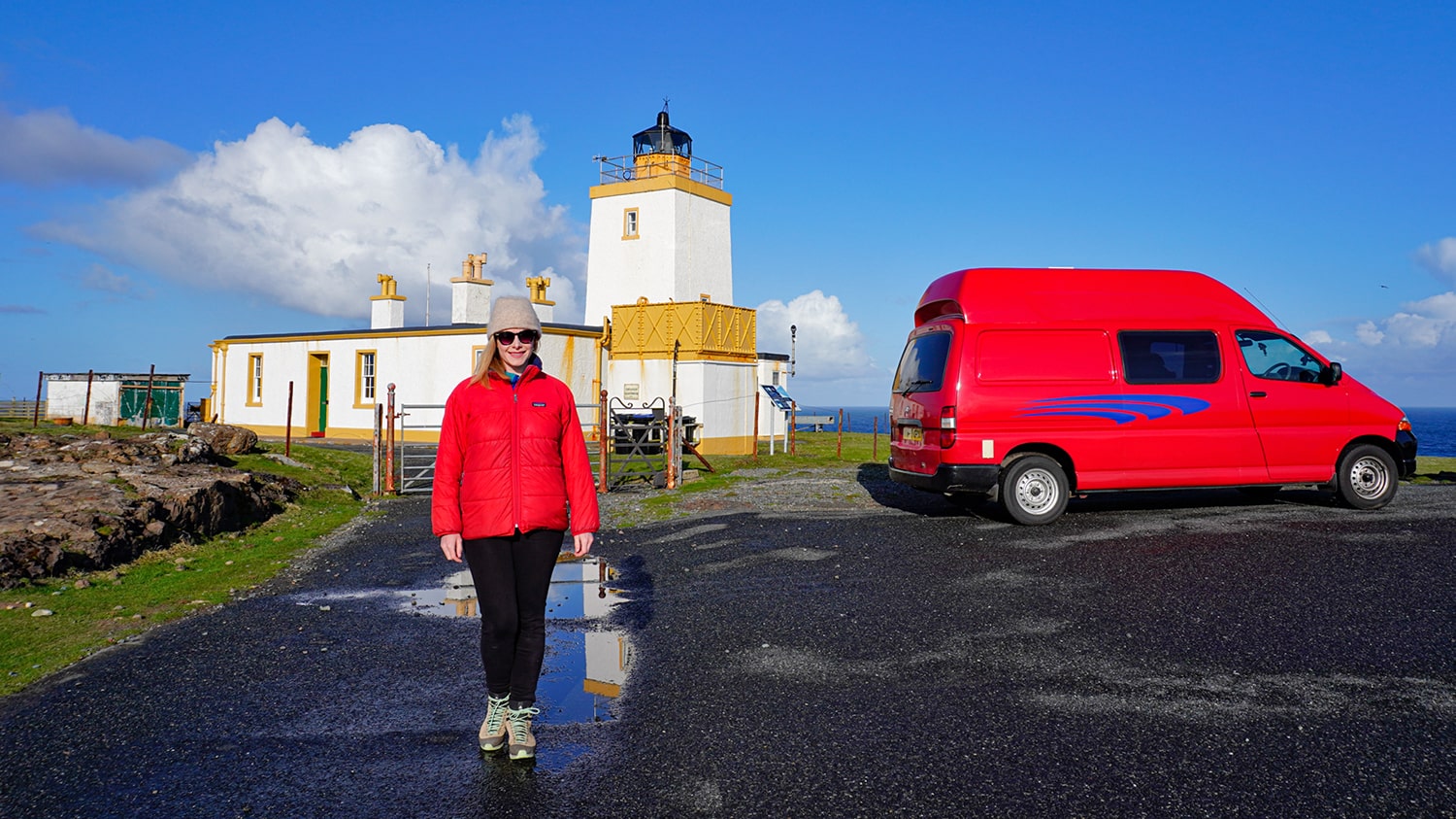 A campervan parked in front of Esha Ness Lighthouse