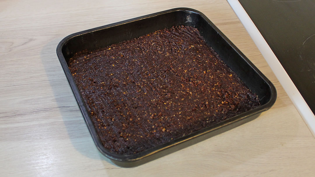 Bake the mint chocolate slice biscuit base for 20 minutes