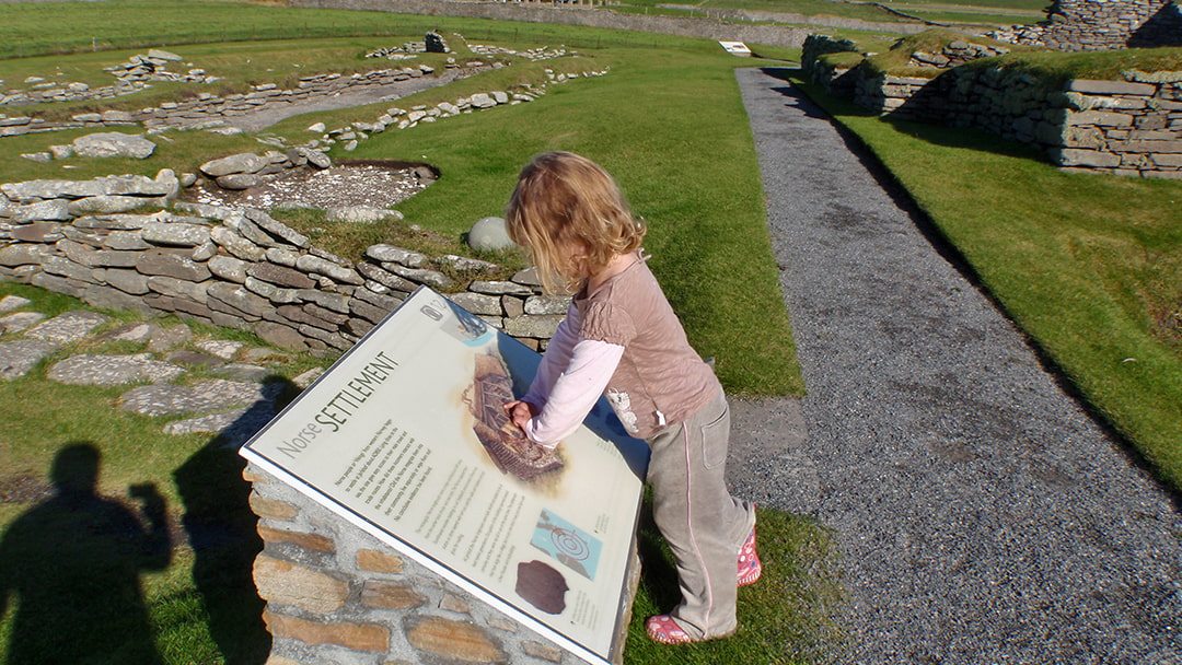 Robin's daughter enjoying exploring Jarshof in Shetland