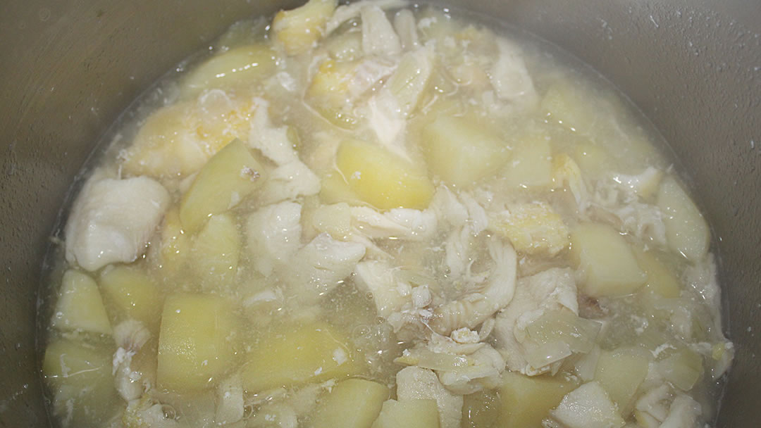Adding the fish and onions in with the tatties