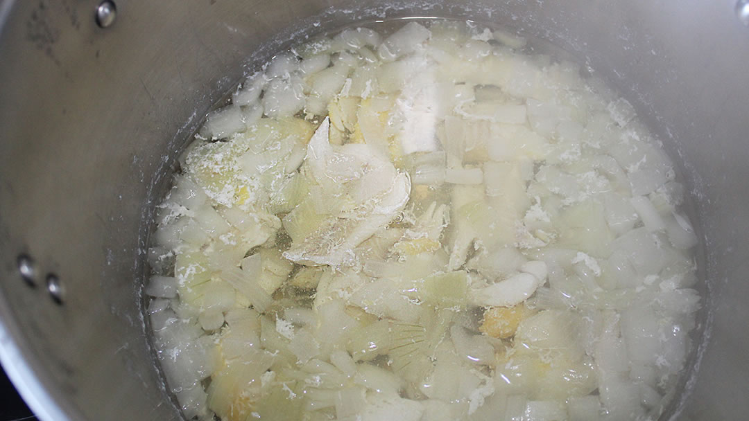 Boiling the fish and onions