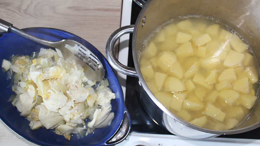 Boiling the tatties in the fishy water