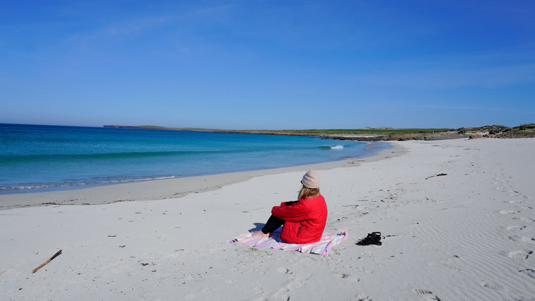 Ruth relaxes on Grobust beach, Westray