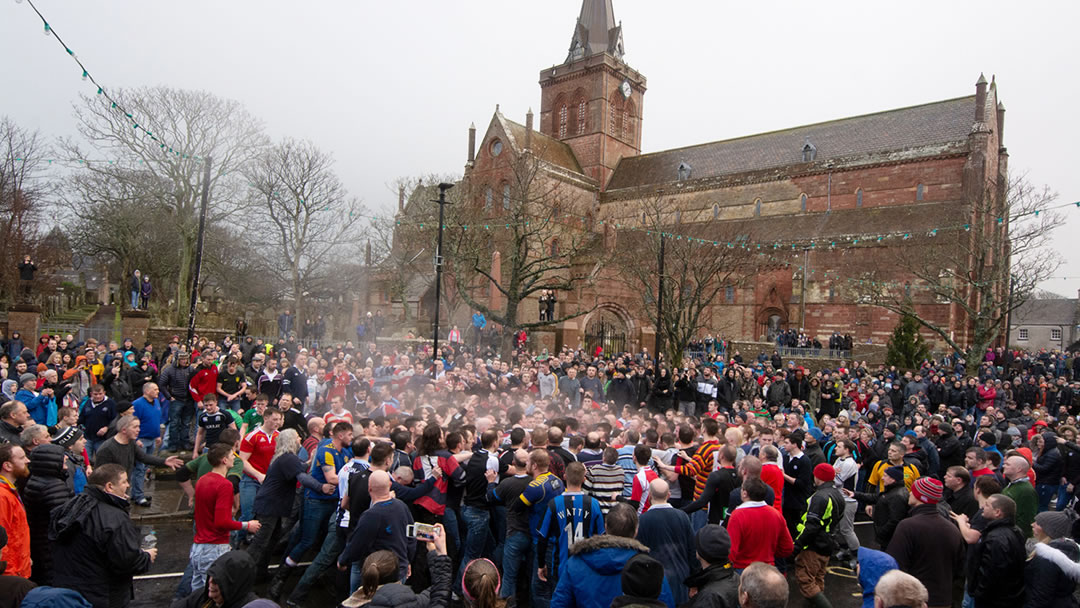 The New Year Ba' 2018 - players and spectators on Broad Street, under St Magnus Cathedral