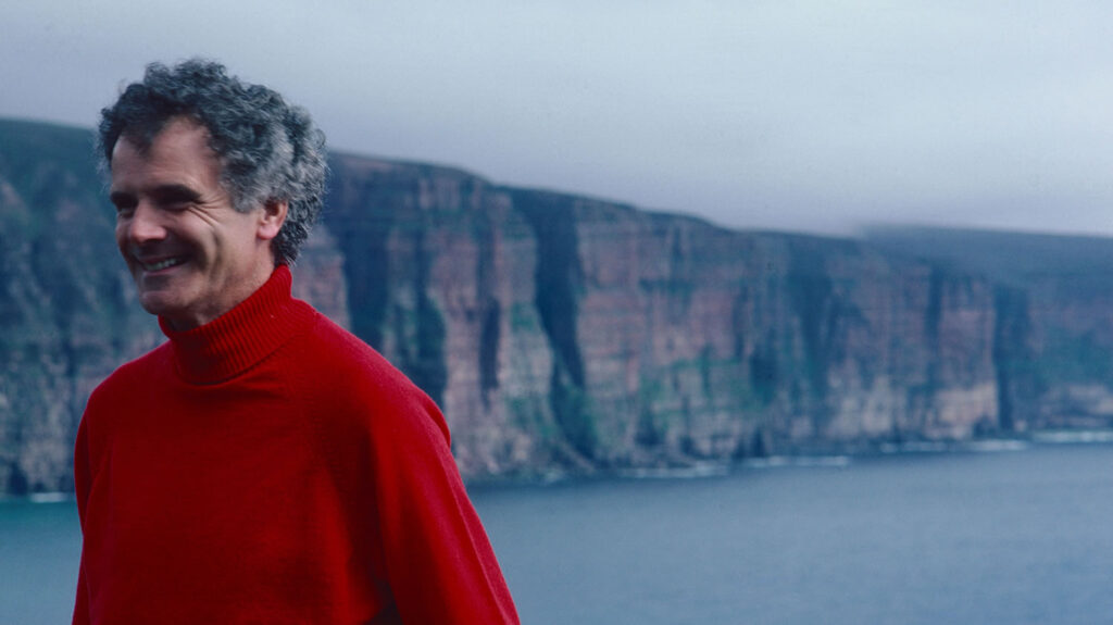 Sir Peter Maxwell Davies with the cliffs of Hoy pictured in the background