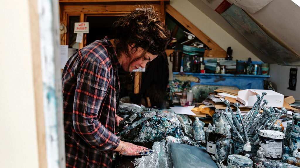 Ruth Brownlee creating art in her Studio