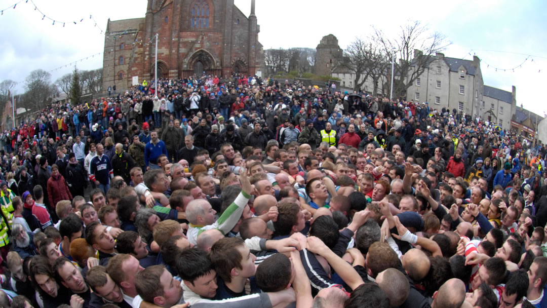 A mass of fighting bodies competiting in the traditional Orkney Game of The Ba'