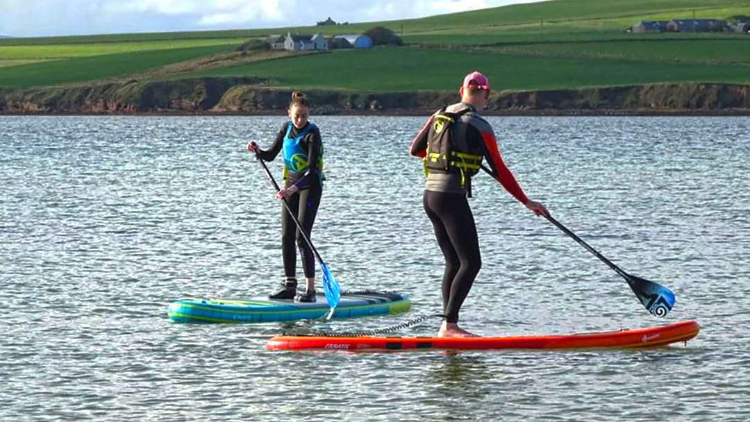 Paddleboarding is a popular water sport to do in Orkney